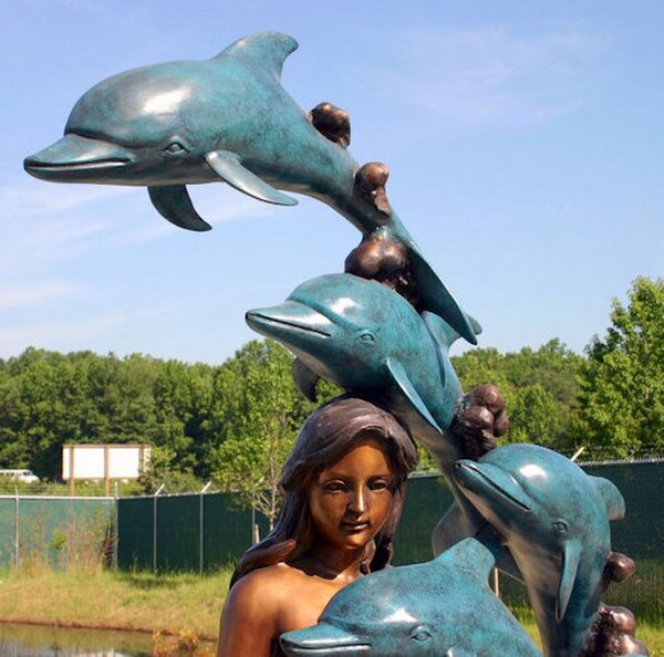 Bronze Mermaid with 8 Dolphins is a mesmerizing and enchanting sculpture